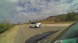 Angry rhino charges car