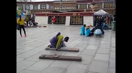 Tibet. Lhasa I. (3) Barkhor. Pilgrims bowing in front of Jokhang temple. 2015