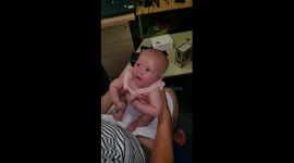 Deaf baby hears for the first time with hearing aids