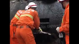 Firefighters rescue worker trapped in asphalt storage tank