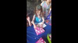 Toddler opens gift that scares her