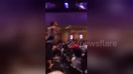 Newsflare Edit - American former YPG volunteer protests during Turkish dictator speech