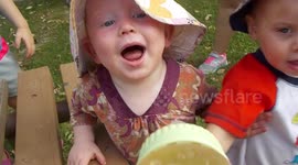 Baby gets squirt in the face