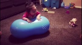 Toddler with Down Syndrome tumbling act