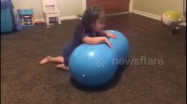 Toddler with Down Syndrome doing a summersault