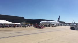 United Airlines Employees Pull 82-ton United Boeing 757 Plane during Fundraising Competition for Special Olympics Virginia Athletes at Dulles International Airport