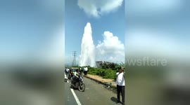Water pipleline bursts forming spectacular plume