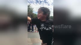 Toddler is overly excited to see Mickey Mouse at Disneyland