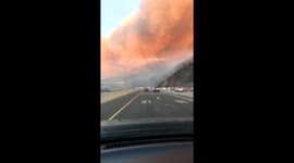 Drivers capture dramatic footage of fast-moving California brush fire