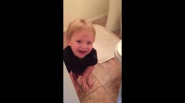 Baby Toddler Laughing, and Playing Hide and Seek in Bathroom