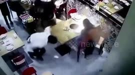 Waiter slips on floor pouring scalding broth on boy