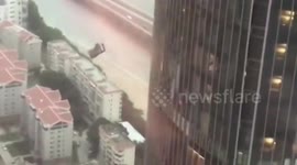 Window-cleaning cradle drops from skyscraper