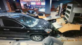 Terrifying moment driver ploughs car into internet cafe
