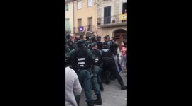 Spanish Guardia Civil charge polling station in Catalan town