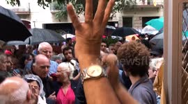 Catalan voters cheered by locals as the leave polling station