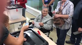 Elderly lady casts her ballot in Catalan independence referendum
