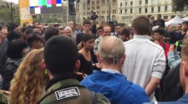 Heated dialogue between protesters at Placa Catalunya