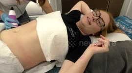 Ruby have a fat cavitation treatment by Prosculpt at The Olympia Beauty show