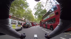 Morning Commute Through London - Red London buses - Royal Courts of Justice