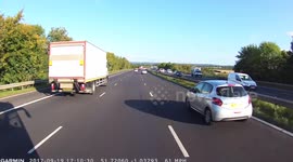 'Woah, woah woah!' Dash-cam captures incredible near miss as bus driver stops just short of car after it spins out of control on M40