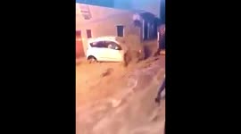 Terrified car driver stranded in flash flood