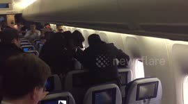 Chinese police escort allegedly drunk passenger out of plane