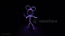 Watching a girl walk along in an LED Minnie Mouse costume made by her dad is the cutest darn thing