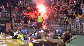 Greek basketball fans light flares at indoor team practice