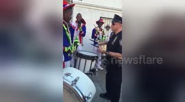 NYPD officer in drum battle with Jamaican marching band