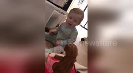 Baby gets terrified by Jack-in-the-box