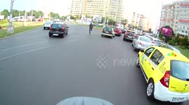 City bus almost runs cyclist into the sidewalk