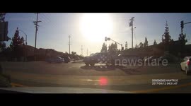 2 Drivers Pass Redlight Almost Running into Each Other.