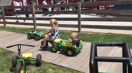 Sister giving little brother a ride