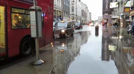 Rain Floods The STrand In London