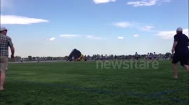 Children trapped in bouncy castle blown across field