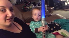 Baby doesn’t want to share lightsaber