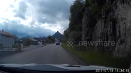 Tourists block the road and take pictures