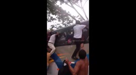 Passengers escape flood-hit bus through windows
