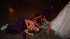 Women face plant as they try to catch bride's bouquet at wedding