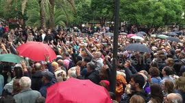 Catalans singing national anthem at biggest referendum polling place