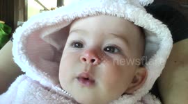 Whistling Baby in Fluffy Hoodie