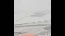 Timelapse of plane landing in snow covered Berlin