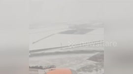 Newsflare Edit - Timelapse of plane landing in snow covered Berlin