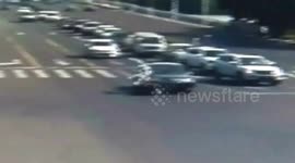 Motorcyclist double somersaults through air after running red light