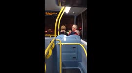 Man plays tin whistle on London bus