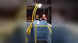 Newsflare Edit - Man plays tin whistle on London bus