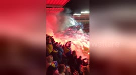 Bosnia soccer fans throw flares onto pitch