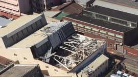 Roof torn off large industrial building