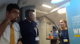 Cabin crew member sings  onboard Ryanair flight