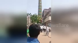 Newsflare Edit - Devotees run as incredibly tall ‘tazia’ tower collapses during Muharram procession